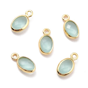 Hangers van Crystal Glass 18k gold oval Aquamarine