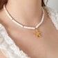 Ketting sea shell wit met Zeester RVS goud