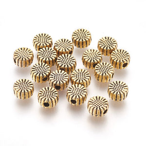 Kraal metaal bloem plat 6x3mm goud