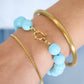 Kralen armband 12mm coral boeislot RVS goud